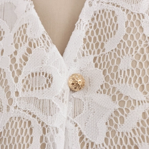 Elegant white lace two-piece set featuring V-neckline and gold hollow button detail