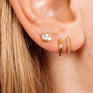 Three-piece 925 sterling silver earring set with gold finish and zircon flower designs
