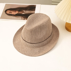 Classic men's khaki Fedora hat with elegant dark band on a minimalist background
