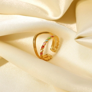 Detail of 18K gold-plated double-layer ring featuring rainbow enamel braided design