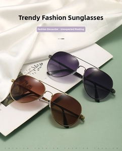 Classic metal aviator sunglasses with gradient lenses on silk texture background