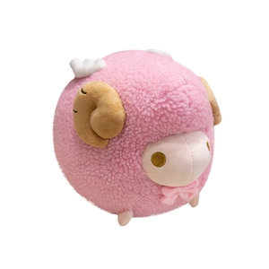 Cute spherical pink lamb plush toy with white wings and brown horns on white background