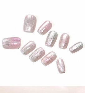 Detailed view of pink aurora cat-eye press-on nails with holographic shimmer finish