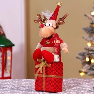 Close-up of a Christmas reindeer plush doll sitting on a festive red plaid gift box base
