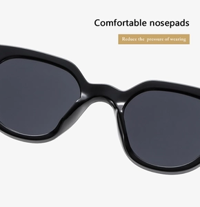 Detailed close-up of integrated nose pads on black sunglasses for enhanced comfort