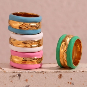 Detail of colorful water wave enamel rings with 18K gold-plated irregular textures