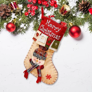 3D snowman Christmas stocking gift bag with Merry Christmas text on snowy background