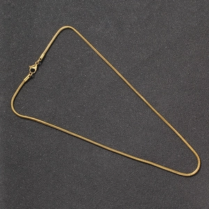 Detailed close-up of 2mm gold round snake chain necklace with lobster clasp