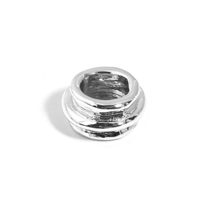 Macro shot of silver alloy large hole bead with irregular texture for DIY jewelry