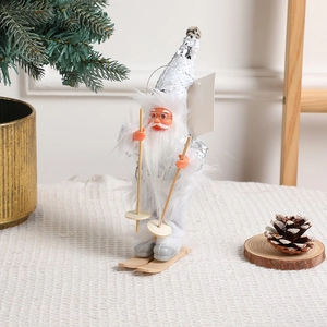 Silver Santa Claus doll figurine on wooden skis with sequins and cozy holiday decor