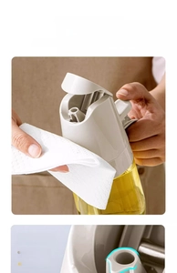 Detail of drip-free teardrop spout on glass oil dispenser for precise kitchen pouring