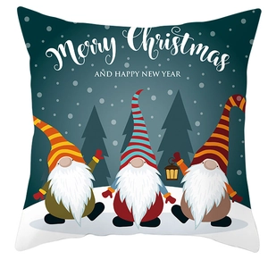 Detail of Christmas pillow cover featuring cute gnomes and Merry Christmas typography