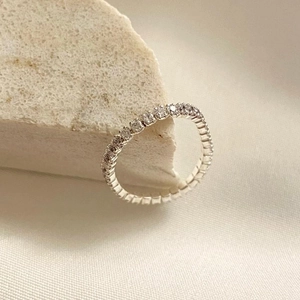 Macro shot of silver S925 ring with sparkling round cubic zirconia pave setting