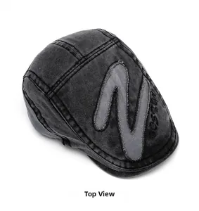 Top view of vintage washed charcoal newsboy cap with Z patch and Boston embroidery