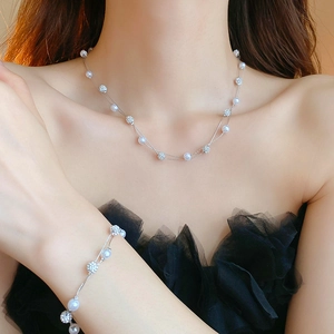 Elegant double-layered faux pearl necklace and bracelet set with sparkling rhinestone balls