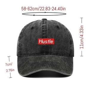Front view of distressed black baseball cap with Hustle embroidery and size dimensions