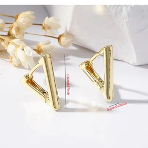 Detailed view of polished gold triangle hoop earrings with 1.2cm size dimensions