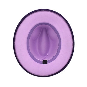 Interior view of purple fedora hat showing black sweatband and 65% cotton care label
