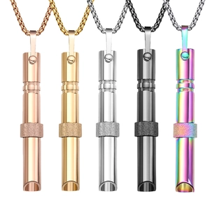 Detail view of 528Hz meditation whistle necklaces in gold, silver, black, and rainbow colors