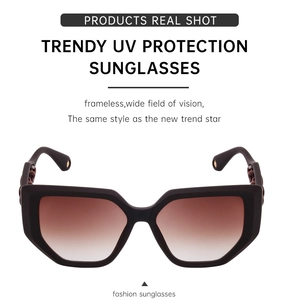 Detail of trendy cat eye sunglasses with gradient lenses and hollow temple design