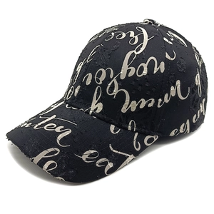 Distressed black baseball cap with white script print and vintage frayed details