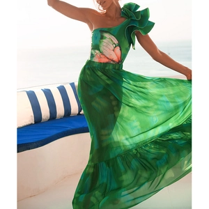 One-shoulder swimsuit featuring a ruffled neckline, butterfly print, and green chiffon skirt