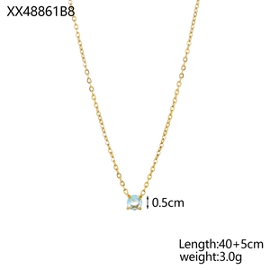 Detail showing a 0.5cm light blue gemstone pendant on a 40+5cm gold chain necklace
