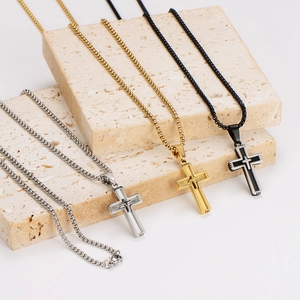 Three men's stainless steel cross necklaces in silver, gold, and black with box chains
