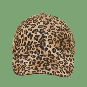 Detailed view of leopard print texture on a six-panel baseball cap with curved brim
