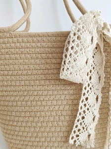 Minimalist khaki cotton rope woven tote bag with delicate lace ribbon decoration