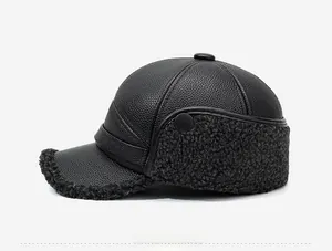 Detail view of winter baseball cap with black pebbled leather and warm gray fleece ear flaps