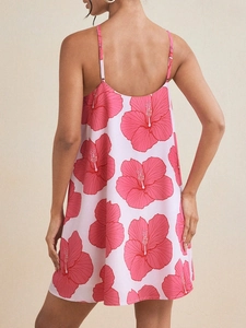 Floral halter backless summer dress with pink hibiscus print and lightweight fabric