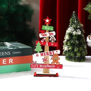 Close-up of wooden Christmas tree tabletop decor with gingerbread man and festive greetings