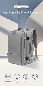 Macro detail of waterproof gray travel backpack showing USB port and buckle