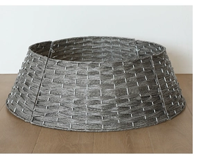 Detail of gray woven Christmas tree collar showing textured Nordic wicker design