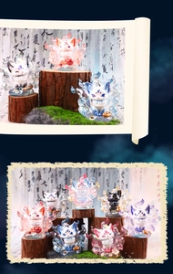 Artistic display of colorful Nine-Tailed Fox resin figurines on mossy wood pedestals