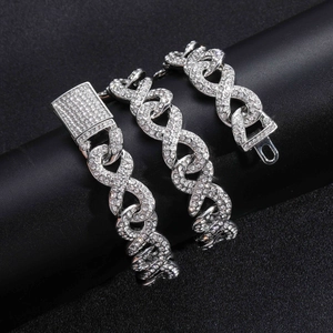 Macro detail of iced-out infinity link chain with luxury crystal diamond pave buckle