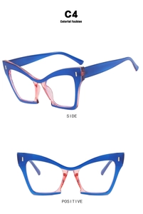 Detail view of pink and blue cat eye glasses frame with silver decorative metal studs