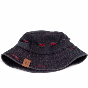 Detail of grey distressed denim bucket hat with red stitching and leather logo patch