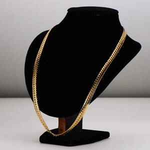 Flat gold dragon chain necklace displayed on a black velvet stand for fashion styling