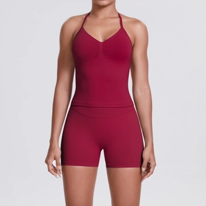 Detail of burgundy seamless yoga set featuring a halter v-neck top and high waist shorts