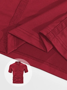 Close-up of red twill knit fabric texture and premium double-needle stitching on Polo shirt