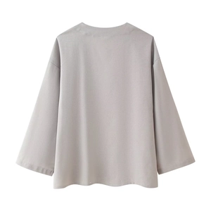 Back view of a minimalist light lilac long-sleeved linen-texture knit top on white background