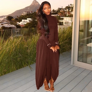 Detailed view of dark brown ruched fabric on high neck long sleeve slit maxi dress