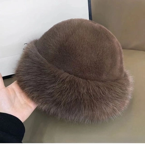 Detail of a plush brown faux fur winter hat showing the soft and thick texture