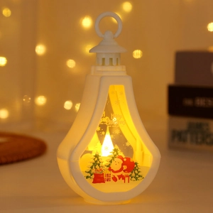Detail of white Christmas lantern with Santa scene and warm LED light effect