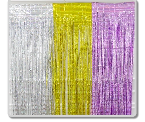 Close-up of metallic silver, gold, and purple fringe curtains for party background