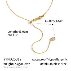 Detail view of gold stainless steel necklace with adjustable sliding bead and zircon charm