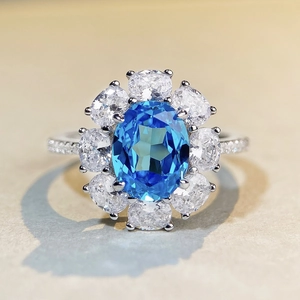 Elegant 925 silver aquamarine halo ring featuring oval blue stone and sparkling diamonds