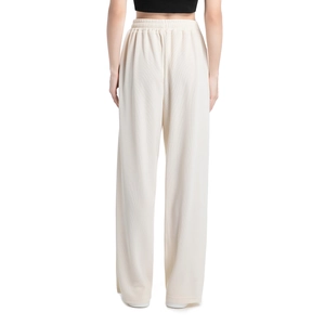 Rear view of women's cream wide-leg joggers with ribbed texture and elastic waist
